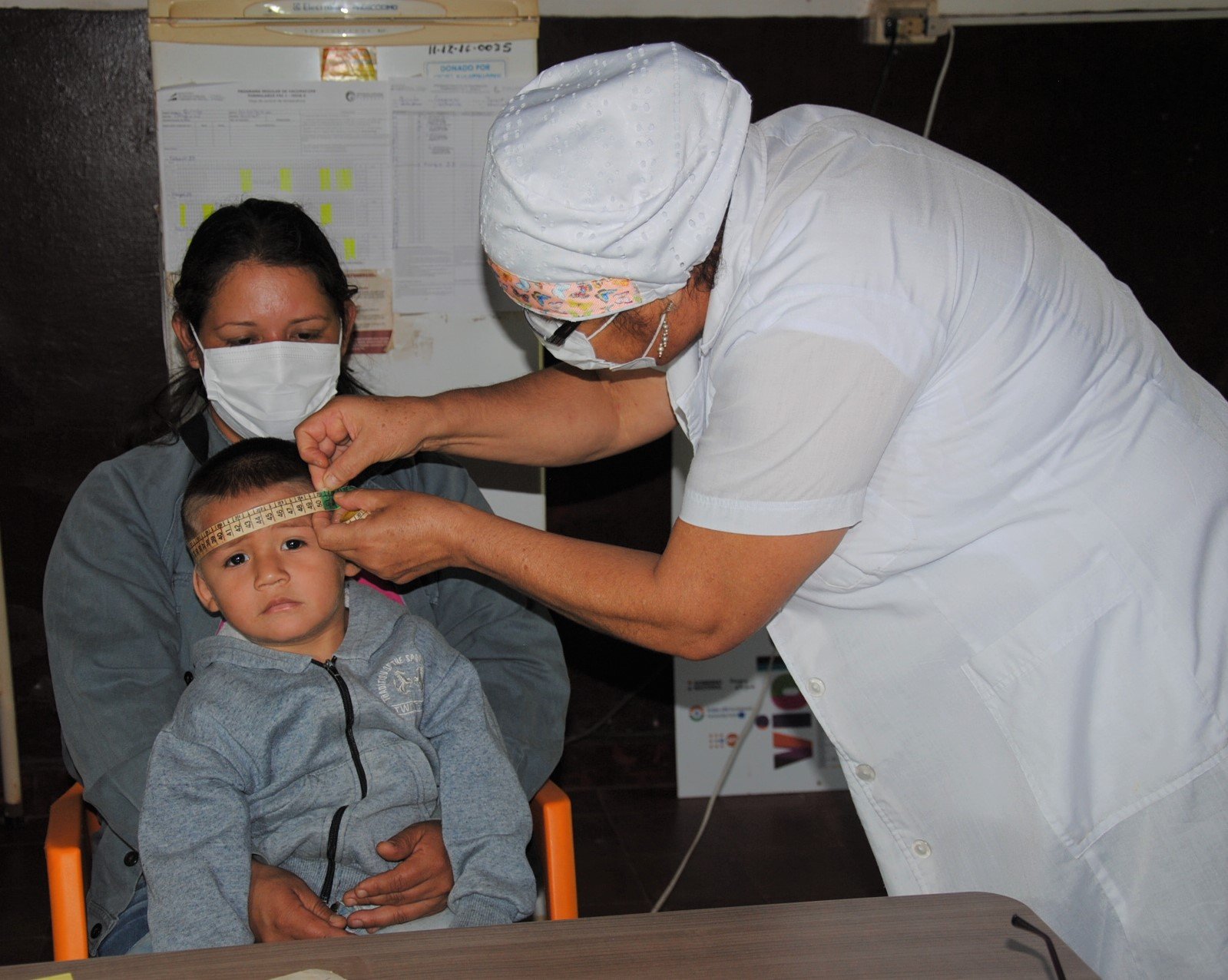 a doctor examining a child